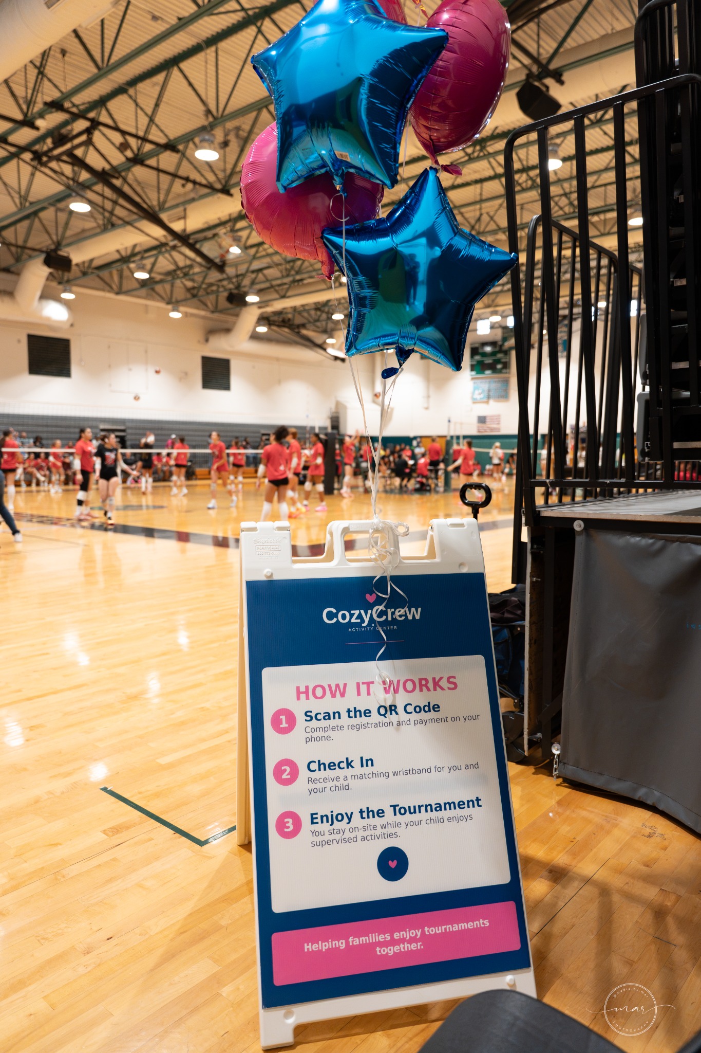 CozyCrew activity center welcome sign inside a tournament venue